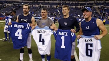 Jan 3, 2016; Indianapolis, IN, USA; Tennessee Titans kicker Ryan Succop (4) and punter Brett Kern (6) exchange jerseys with Indianapolis Colts kicker Adam Vinatieri (4) and punter Pat McAfee (1) after the game at Lucas Oil Stadium. Indianapolis defeats Tennessee 30-24. Mandatory Credit: Brian Spurlock-USA TODAY Sports