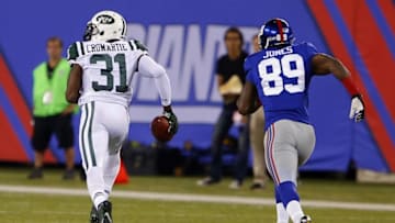 Aug 29, 2015; East Rutherford, NJ, USA; New York Jets defensive back Antonio Cromartie (31) runs to the end zone after intercepting a pass from New York Giants quarterback Eli Manning (10) during the first half at MetLife Stadium. Mandatory Credit: Noah K. Murray-USA TODAY Sports
