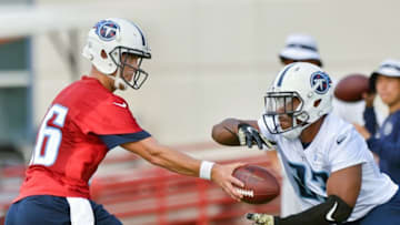 Jun 14, 2016; Nashville, TN, USA; Tennessee Titans quarter back Matt Cassel (16) hands off to Titans running back David Cobb (23) during mini camp practice at Saint Thomas Sports Park. Mandatory Credit: Jim Brown-USA TODAY Sports