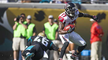 Dec 20, 2015; Jacksonville, FL, USA; Atlanta Falcons wide receiver Devin Hester (17) avoids a tackle from Jacksonville Jaguars long snapper Carson Tinker (46) in the second quarter at EverBank Field. The Atlanta Falcons won 23-17. Mandatory Credit: Logan Bowles-USA TODAY Sports