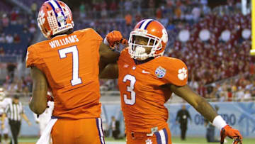 Dec 29, 2014; Orlando, FL, USA; Clemson Tigers defensive end Vic Beasley (3) celebrates with wide receiver Mike Williams (7) after scoring a touchdown against the Oklahoma Sooners during the first quarter of the 2014 Russell Athletic Bowl at Florida Citrus Bowl. Mandatory Credit: Joshua S. Kelly-USA TODAY Sports