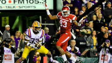 Nov 14, 2015; Baton Rouge, LA, USA; LSU Tigers safety Jamal Adams (33) intercepts a pass intended for Arkansas Razorbacks tight end Jeremy Sprinkle (83) during the second quarter of a game at Tiger Stadium. Mandatory Credit: Derick E. Hingle-USA TODAY Sports