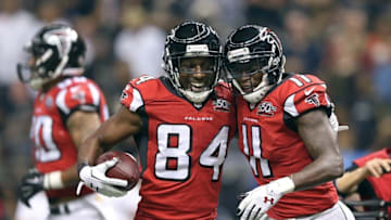 Oct 15, 2015; New Orleans, LA, USA; Atlanta Falcons wide receiver Roddy White (84) celebrates with wide receiver Julio Jones (11) after his touchdown catch in the second quarter against the New Orleans Saints of their game at the Mercedes-Benz Superdome. Mandatory Credit: Chuck Cook-USA TODAY Sports