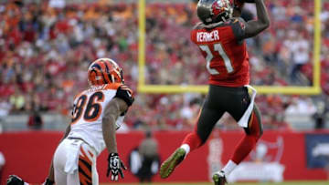 Nov 30, 2014; Tampa, FL, USA; Tampa Bay Buccaneers cornerback Alterraun Verner (21) intercepts a pass in front of Cincinnati Bengals wide receiver James Wright (86) in the first half at Raymond James Stadium. Mandatory Credit: David Manning-USA TODAY Sports