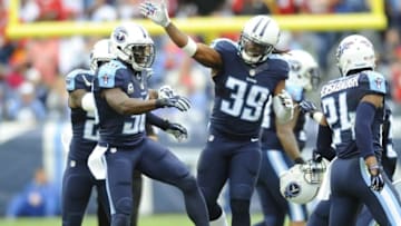 Oct 25, 2015; Nashville, TN, USA; Tennessee Titans cornerback Jason McCourty (30) is congratulated by strong safety Daimion Stafford (39) after a fourth down defensive stop during the first half against the Atlanta Falcons at Nissan Stadium. Mandatory Credit: Christopher Hanewinckel-USA TODAY Sports