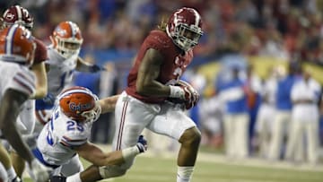 Dec 5, 2015; Atlanta, GA, USA; Alabama Crimson Tide running back Derrick Henry (2) carries the ball past Florida Gators linebacker Matt Rolin (25) during the fourth quarter in the 2015 SEC Championship Game at the Georgia Dome. Mandatory Credit: Dale Zanine-USA TODAY Sports