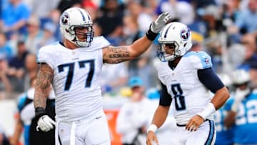 Aug 20, 2016; Nashville, TN, USA; Tennessee Titans tackle Taylor Lewan (77) interacts with quarterback Marcus Mariota (8) after a play during the first quarter against Carolina Panthers at Nissan Stadium. Mandatory Credit: Joshua Lindsey-USA TODAY Sports