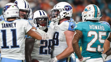 Sep 1, 2016; Miami Gardens, FL, USA; Tennessee Titans running back Antonio Andrews (center) celebrates after scoring a touchdown during the first half against the Miami Dolphins at Hard Rock Stadium. Mandatory Credit: Steve Mitchell-USA TODAY Sports
