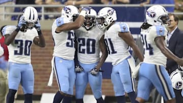 Sep 18, 2016; Detroit, MI, USA; Tennessee Titans cornerback Perrish Cox (20) celebrates with inside linebacker Wesley Woodyard (59) and safety Kevin Byard (31) after an interception during the fourth quarter against the Detroit Lions at Ford Field. Titans win 16-15. Mandatory Credit: Raj Mehta-USA TODAY Sports