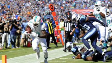 Oct 18, 2015; Nashville, TN, USA; Miami Dolphins receiver Jarvis Landry (14) scores a touchdown during the first half against the Tennessee Titans at Nissan Stadium. Mandatory Credit: Christopher Hanewinckel-USA TODAY Sports