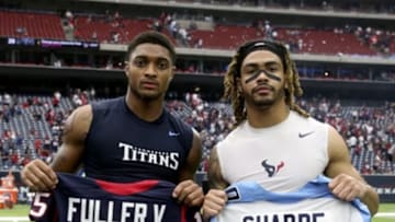 Oct 2, 2016; Houston, TX, USA; Tennessee Titans wide receiver Tajae Sharpe (19) and Houston Texans wide receiver Will Fuller (15) swap jerseys and pose for a photo after the game at NRG Stadium. Mandatory Credit: Kevin Jairaj-USA TODAY Sports