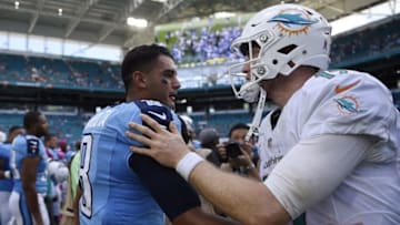 Oct 9, 2016; Miami Gardens, FL, USA; Tennessee Titans quarterback Marcus Mariota (left) greets Miami Dolphins quarterback Ryan Tannehill (right) after their game at Hard Rock Stadium. Titans won 30-17. Mandatory Credit: Steve Mitchell-USA TODAY Sports