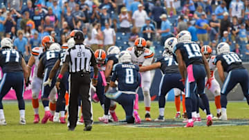 Oct 16, 2016; Nashville, TN, USA; Tennessee Titans quarterback Marcus Mariota (8) takes a knee to down the ball and end the game against the Cleveland Browns during the second half at Nissan Stadium. Tennessee won 28-26. Mandatory Credit: Jim Brown-USA TODAY Sports