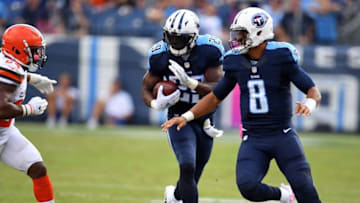 Oct 16, 2016; Nashville, TN, USA; Tennessee Titans running back DeMarco Murray (29) runs behind lead blocking by Marcus Mariota (8) in the second half at Nissan Stadium. The Titans won 28-26. Mandatory Credit: Christopher Hanewinckel-USA TODAY Sports
