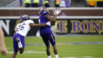 Sep 3, 2016; Greenville, NC, USA; East Carolina Pirates wide receiver Zay Jones (7) catches a first quarter pass against Western Carolina Catamounts defensive back Trey Morgan (26) at Dowdy-Ficklen Stadium. Mandatory Credit: James Guillory-USA TODAY Sports