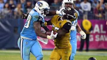 Oct 27, 2016; Nashville, TN, USA; Tennessee Titans running back DeMarco Murray (29) is called for a face masking penalty on Jacksonville Jaguars defensive end Dante Fowler Jr. (56) after a short gain in the second half at Nissan Stadium. The Titans won 36-22. Mandatory Credit: Christopher Hanewinckel-USA TODAY Sports