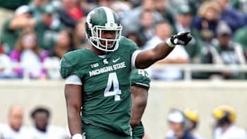 Oct 29, 2016; East Lansing, MI, USA; Michigan State Spartans defensive lineman Malik McDowell (4) gestures to the sidelines during the first half of a game against the Michigan Wolverines at Spartan Stadium. Mandatory Credit: Mike Carter-USA TODAY Sports
