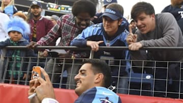 Nov 13, 2016; Nashville, TN, USA; Tennessee Titans quarterback Marcus Mariota (8) poses for a selfie with fans after a win against the Green Bay Packers at Nissan Stadium. The Titans won 47-25. Mandatory Credit: Christopher Hanewinckel-USA TODAY Sports