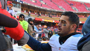 Dec 18, 2016; Kansas City, MO, USA; Tennessee Titans quarterback Marcus Mariota (8) signs autographs for fans after the game against the Kansas City Chiefs at Arrowhead Stadium. Tennessee won 19-17. Mandatory Credit: Denny Medley-USA TODAY Sports