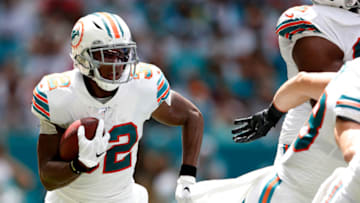 MIAMI, FLORIDA - SEPTEMBER 15: Kenyan Drake #32 of the Miami Dolphins runs with the ball against the New England Patriots during the second quarter in the game at Hard Rock Stadium on September 15, 2019 in Miami, Florida. (Photo by Michael Reaves/Getty Images)