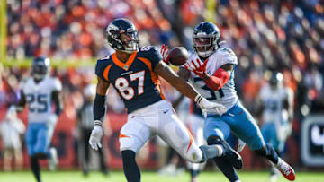 DENVER, CO - OCTOBER 13: Kevin Byard #31 of the Tennessee Titans intercepts a pass intended for Noah Fant #87 of the Denver Broncos in the third quarter at Empower Field at Mile High on October 13, 2019 in Denver, Colorado. (Photo by Dustin Bradford/Getty Images)