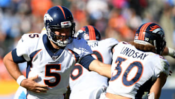 CARSON, CALIFORNIA - OCTOBER 06: Joe Flacco #5 of the Denver Broncos hands off to Phillip Lindsay #30 during the third quarter in a 20-13 Broncos win over the Los Angeles Chargers at Dignity Health Sports Park on October 06, 2019 in Carson, California. (Photo by Harry How/Getty Images)