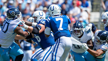 NASHVILLE, TN - SEPTEMBER 15: Jacoby Brissett #7 of the Indianapolis Colts drops back to pass and is grabbed by Sharif Finch #56 and Isaiah Mack #97 of the Tennessee Titans at Nissan Stadium on September 15, 2019 in Nashville,Tennessee. The Colts defeated the Titans 19-17. (Photo by Wesley Hitt/Getty Images)