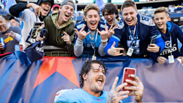 NASHVILLE, TN - NOVEMBER 10: Taylor Lewan #77 of the Tennessee Titans takes a selfie with fans after of a game against the Kansas City Chiefs at Nissan Stadium on November 10, 2019 in Nashville, Tennessee. The Titans defeated the Chiefs 35-32. (Photo by Wesley Hitt/Getty Images)