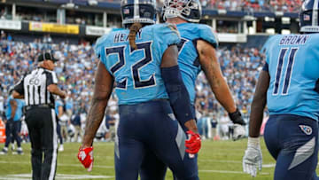 NASHVILLE, TENNESSEE - OCTOBER 20: Derrick Henry #22 of the Tennessee Titans celebrates with teammate Taylor Lewan #77 after scoring a touchdown against the Los Angeles Chargers during the second half at Nissan Stadium on October 20, 2019 in Nashville, Tennessee. (Photo by Frederick Breedon/Getty Images)