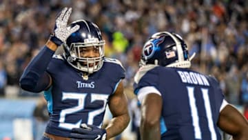 NASHVILLE, TN - NOVEMBER 24: Derrick Henry #22 celebrates with A.J. Brown #11of the Tennessee Titans after Brown scored a touchdown against the Jacksonville Jaguars during the second half at Nissan Stadium on November 24, 2019 in Nashville, Tennessee. The Titans defeated the Jaguars 42-20. (Photo by Wesley Hitt/Getty Images)