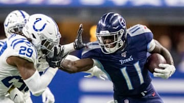 INDIANAPOLIS, IN - DECEMBER 01: A.J. Brown #11 of the Tennessee Titans stiff arms Malik Hooker #29 of the Indianapolis Colts after making a catch in the third quarter of the game against the Indianapolis Colts at Lucas Oil Stadium on December 1, 2019 in Indianapolis, Indiana. (Photo by Bobby Ellis/Getty Images)