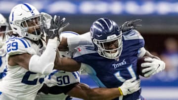 INDIANAPOLIS, IN - DECEMBER 01: A.J. Brown #11 of the Tennessee Titans stiff arms Malik Hooker #29 of the Indianapolis Colts after making a catch in the third quarter of the game against the Indianapolis Colts at Lucas Oil Stadium on December 1, 2019 in Indianapolis, Indiana. (Photo by Bobby Ellis/Getty Images)