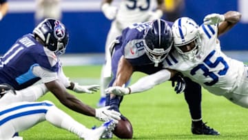 INDIANAPOLIS, IN - DECEMBER 01: A.J. Brown #11, Jonnu Smith #81 of the Tennessee Titans and Pierre Desir #35 of the Indianapolis Colts battle for a fumble in the fourth quarter of the game at Lucas Oil Stadium on December 1, 2019 in Indianapolis, Indiana. (Photo by Bobby Ellis/Getty Images)