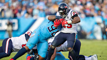 NASHVILLE, TN - DECEMBER 15: Carlos Hyde #23 of the Houston Texans is tackled in the first half by Jeffery Simmons #98 of the Tennessee Titans at Nissan Stadium on December 15, 2019 in Nashville, Tennessee. (Photo by Wesley Hitt/Getty Images)