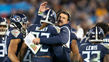 NASHVILLE, TN - NOVEMBER 24: Head Coach Mike Vrabel congratulates Derrick Henry #22 of the Tennessee Titans after scoring a touchdown during the second half of a game against the Jacksonville Jaguars at Nissan Stadium on November 24, 2019 in Nashville, Tennessee. The Titans defeated the Jaguars 42-20. (Photo by Wesley Hitt/Getty Images)