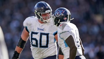OAKLAND, CALIFORNIA - DECEMBER 08: A.J. Brown #11 of the Tennessee Titans is congratulated by Ben Jones #60 after Brown scored a touchdown against the Oakland Raiders during the first half of an NFL football game at RingCentral Coliseum on December 08, 2019 in Oakland, California. (Photo by Thearon W. Henderson/Getty Images)
