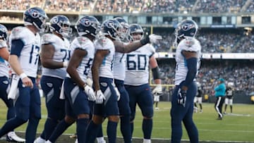 OAKLAND, CALIFORNIA - DECEMBER 08: Jonnu Smith #81 of the Tennessee Titans celebrates with teammates after scoring a touchdown in the fourth quarter against the Oakland Raiders at RingCentral Coliseum on December 08, 2019 in Oakland, California. (Photo by Lachlan Cunningham/Getty Images)