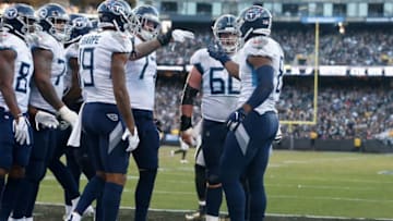 OAKLAND, CALIFORNIA - DECEMBER 08: Jonnu Smith #81 of the Tennessee Titans celebrates with teammates after scoring a touchdown in the fourth quarter against the Oakland Raiders at RingCentral Coliseum on December 08, 2019 in Oakland, California. (Photo by Lachlan Cunningham/Getty Images)
