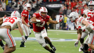 INDIANAPOLIS, INDIANA - DECEMBER 07: Jonathan Taylor #23 of the Wisconsin Badgers runs the ball in the Big Ten Championship game against the Ohio State Buckeyes at Lucas Oil Stadium on December 07, 2019 in Indianapolis, Indiana. (Photo by Justin Casterline/Getty Images)