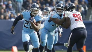 NASHVILLE, TENNESSEE - DECEMBER 15: Running back Derrick Henry #22 of the Tennessee Titans rushes against the Houston Texans during the first half at Nissan Stadium on December 15, 2019 in Nashville, Tennessee. (Photo by Frederick Breedon/Getty Images)