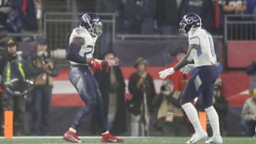 FOXBOROUGH, MASSACHUSETTS - JANUARY 04: Derrick Henry #22 of the Tennessee Titans celebrates his touchdown with teammate A.J. Brown #11 against the New England Patriots in the second quarter of the AFC Wild Card Playoff game at Gillette Stadium on January 04, 2020 in Foxborough, Massachusetts. (Photo by Elsa/Getty Images)