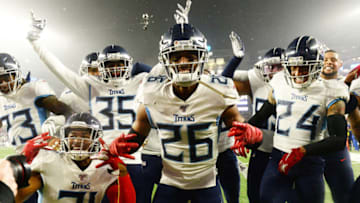 FOXBOROUGH, MASSACHUSETTS - JANUARY 04: Logan Ryan #26 of the Tennessee Titans celebrates his touchdown with teammates against the New England Patriots in the fourth quarter of the AFC Wild Card Playoff game at Gillette Stadium on January 04, 2020 in Foxborough, Massachusetts. (Photo by Kathryn Riley/Getty Images)