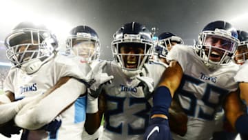 FOXBOROUGH, MASSACHUSETTS - JANUARY 04: Tye Smith #23, Wesley Woodyard #59 of the Tennessee Titans and teammates celebrate a fourth-quarter touchdown by teammate Logan Ryan #26 against the New England Patriots in the AFC Wild Card Playoff game at Gillette Stadium on January 04, 2020 in Foxborough, Massachusetts. (Photo by Kathryn Riley/Getty Images)