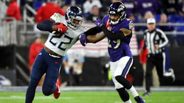 BALTIMORE, MARYLAND - JANUARY 11: Derrick Henry #22 of the Tennessee Titans carries the ball against Earl Thomas #29 of the Baltimore Ravens during the AFC Divisional Playoff game at M&T Bank Stadium on January 11, 2020 in Baltimore, Maryland. (Photo by Will Newton/Getty Images)