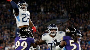 BALTIMORE, MARYLAND - JANUARY 11: Derrick Henry #22 of the Tennessee Titans throws a touchdown pass to Corey Davis (not pictured) in the third quarter of the AFC Divisional Playoff game against the Baltimore Ravens at M&T Bank Stadium on January 11, 2020 in Baltimore, Maryland. (Photo by Todd Olszewski/Getty Images)