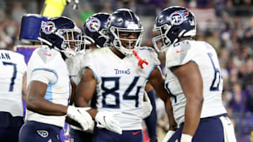 BALTIMORE, MARYLAND - JANUARY 11: Corey Davis #84 of the Tennessee Titans celebrates with teammates after catching a touchdown pass during the third quarter against the Baltimore Ravens in the AFC Divisional Playoff game at M&T Bank Stadium on January 11, 2020 in Baltimore, Maryland. (Photo by Rob Carr/Getty Images)