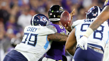 BALTIMORE, MARYLAND - JANUARY 11: Jurrell Casey #99 of the Tennessee Titans sacks Lamar Jackson #8 of the Baltimore Ravens during the second half in the AFC Divisional Playoff game at M&T Bank Stadium on January 11, 2020 in Baltimore, Maryland. (Photo by Rob Carr/Getty Images)