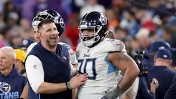 BALTIMORE, MARYLAND - JANUARY 11: Head coach Mike Vrabel talks with DaQuan Jones #90 of the Tennessee Titans during the closing moments of AFC Divisional Playoff game against the Baltimore Ravens at M&T Bank Stadium on January 11, 2020 in Baltimore, Maryland. (Photo by Rob Carr/Getty Images)