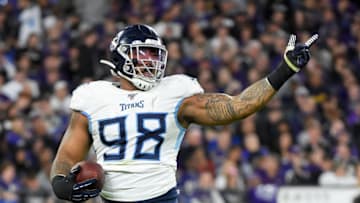 BALTIMORE, MARYLAND - JANUARY 11: Jeffery Simmons #98 of the Tennessee Titans celebrates after a fumble by Lamar Jackson #8 of the Baltimore Ravens during the AFC Divisional Playoff game at M&T Bank Stadium on January 11, 2020 in Baltimore, Maryland. (Photo by Will Newton/Getty Images)