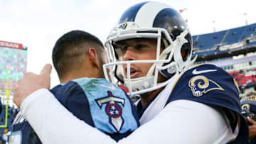 NASHVILLE, TN - DECEMBER 24: Quarterback Jared Goff #16 of the Los Angeles Rams embraces Quarterback Marcus Mariota #8 of the Tennessee Titans following his win at Nissan Stadium on December 24, 2017 in Nashville, Tennessee. (Photo by Shaban Athuman/Getty Images)